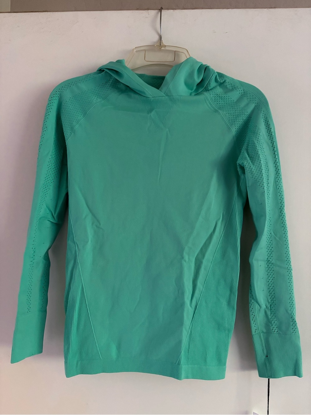 ZYIA Active Women’s Peak Performance Hoodie in turquoise.
